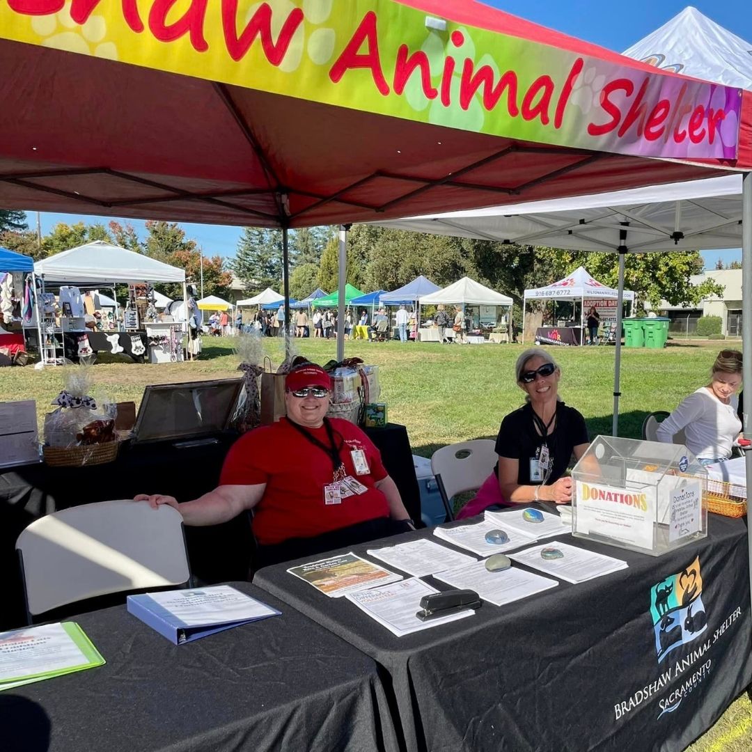 volunteers at a vender booth
