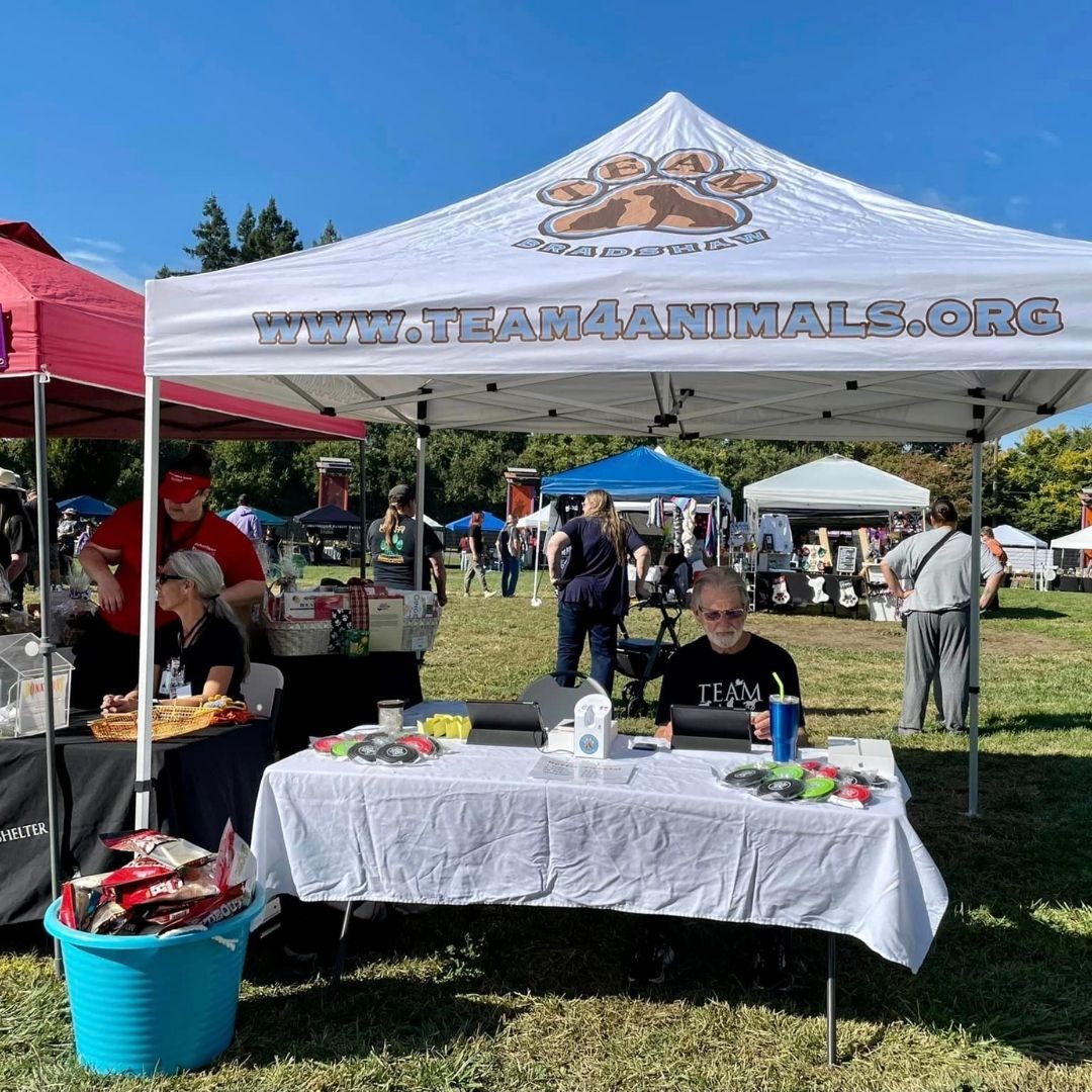 volunteers at a vender booth